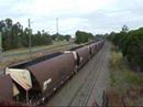 Pacific National locos 9035, 9016 and 8225 power up through Maitland on their way out to Kooragang Island unloader with a full load of coal.  Roughly 110 wagons from a quick count.
