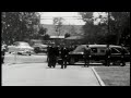 brief clip of marilyn monroe's funeral. eulogy given by lee strasberg. narrated by john huston.
