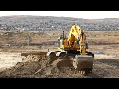 komatsu - Someone in a nice shiny Komatsu 1250 loading trucks like a girl. At 4:04 you see the obligatory Komatsu mechanic reassuring the 1250 that it's ok so it doesn...