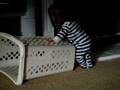 Caleb Joe pushing laundry basket