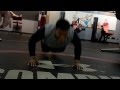 Cam Newton Pushup shoulder tap at Under Armour Training Cen - Perform a pushup and as you come up tap your shoulder with your opposite hand. Focus on not rotating your hips as you lift your hand off the ground and engage your core.