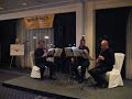 performance by a trio from the pittsburgh symphony orchestra during the allegheny conference european tour. this was their stop in amsterdam, the okura hotel