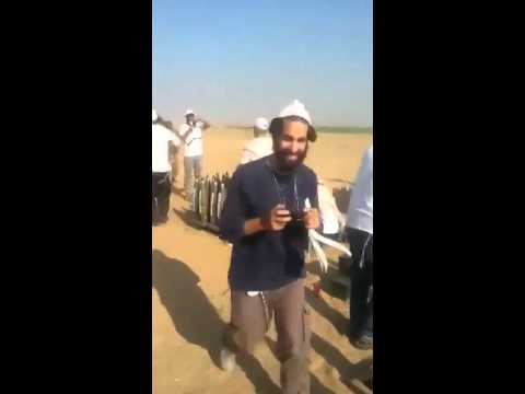 Israeli soldiers and members of the Breslauer Hassidic sect dance and bless artillery shells