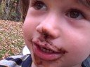 Jameson eats a frosted chocolate cupcake