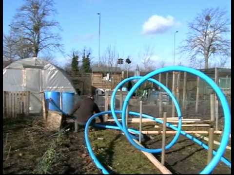 polytunnels - Battling with the element, age, a bad back and terminal procrastination we get the skeleton of the polytunnel up and ready for covering.