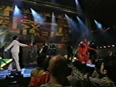 award shows - The Fugees rock the crowd at some award show. Nas steps out for a guest appearance looking like the Syracuse orangeman mascot.