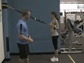 Saint Augustine Fitness Boot Camp Gym Trainer shows TRX L for Shoulders