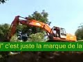 Conduire une pelleteuse, monter en haut d\ Conduire une pelleteuse, monter en haut d\