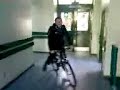 Calin riding his bike though the school!