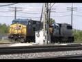 CSXT 9007 pushes an eastbound light power job at Aurora, IL.
