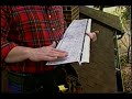 Tim Carter, of AsktheBuilder.com, demonstrates gutter guards and the challenges these products face once installed.