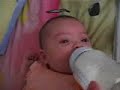 Christina sucking on her bottle