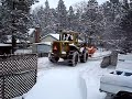 Articulated loader plowing snow in Big Bear Articulated loader plowing snow in Big Bear