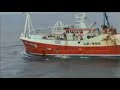UK fishing boat dumping unwanted fish into the sea