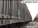High Quality - CSX B738 through Hatfield PA on CSX Bethlehem Branch (hard to believe it was once a busy double track main under The Reading and later Conrail) taking a single lumber car for Shelly and a string of trash cars for storage up to Telford to interchange with ESPN November 26 2008