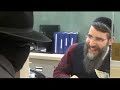 Lipa and Avraham Fried in the bank