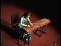 this beautiful piece sounds like guqin music (??), chinese zither with 7 strings. in fact it is performed on guzheng (chinese harp with 21 strings) by liu fang who is best known as the virtuoso of the pipa (chinese lute). the title is tie ma yin (???) composed by zhao dengshan (???). (source: http://www.philmultic.com/liufang/video/ )