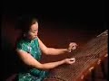 this beautiful piece sounds like guqin music (??), chinese zither with 7 strings. in fact it is performed on guzheng (chinese harp with 21 strings) by liu fang who is best known as the virtuoso of the pipa (chinese lute). the title is tie ma yin (???) composed by zhao dengshan (???). (source: http://www.philmultic.com/liufang/video/ )