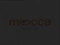Edited Mocca body-builder showing house advertisement Edited Mocca body-builder showing house advertisement