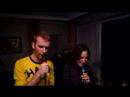 Chris and Suzanne are playing SingStar and singing, quite beautiful if I might add, the song 