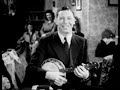 George Formby plays his ukulele banjo. George Formby plays his ukulele banjo.