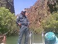 park ranger doug explains the features and wildlife of twin falls gorge, kakadu national park, nt, australia, 20th august 2008. in it he shows us a styrofoam ball used to determine, by toothmark length, whether there are any freshwater or saltwater crocs in the gorge and how many.