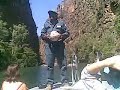park ranger doug explains the features and wildlife of twin falls gorge, kakadu national park, nt, australia, 20th august 2008. in it he shows us a styrofoam ball used to determine, by toothmark length, whether there are any freshwater or saltwater crocs in the gorge and how many.