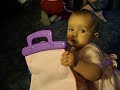 Elijah showing Jaiden her new purse