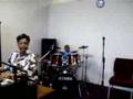 Jacolby playing drums