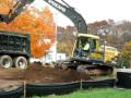 volvo e160blc excavator loading a kenworth dumptruck