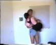tall women carrying small man