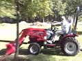 Roofing with a small Mahindra Tractor