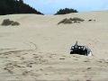 IH Scout jumping at the sand dunes