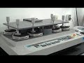 A Martindale machine tests abrasion resistance on Polartec fabrics.