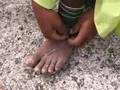 Raramuri Indian Ties His Huarache Sandals