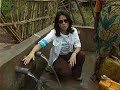 unicef ambassador lucy liu shows residents of a camp for internally displaced people in the dr congo that a unicef-supplied water source is safe for drinking.