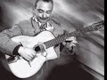 Jazz guitar genius Django Reinhardt with the Quintette du Hot Club de France for the 1937 recording of 