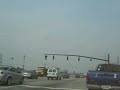 i was in my car like the stephanie crossing and i had my camera with me thank god and a train came along now this is not like normal crossings the mast signals are only 3 feet tall and the cantilever signals are monster sized one signal normaly has one support this one has two but thats on the other side of the train 
i did get the signal maker is western cullins haynes (sp?) and the lights are from a manufacturer called modern industries anyone know if they are still around?  by the way the traffic lights flash yellow for the highway and red for the road across the street thomason blvd