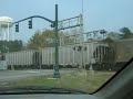 i was in my car like the stephanie crossing and i had my camera with me thank god and a train came along now this is not like normal crossings the mast signals are only 3 feet tall and the cantilever signals are monster sized one signal normaly has one support this one has two but thats on the other side of the train 
i did get the signal maker is western cullins haynes (sp?) and the lights are from a manufacturer called modern industries anyone know if they are still around?  by the way the traffic lights flash yellow for the highway and red for the road across the street thomason blvd