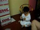 Cute baby cracks open peanuts