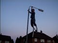 john climbing a lamppost