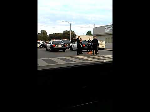 Long Beach - Police say it started with a fight over a beer can outside a liquor store. Suspect Porfirio Santos Lopez threw punches toward a group of men. The suspect's s...