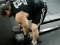 Mike Wolfe playing with 150 pound Dumbbells