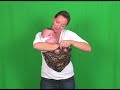A guide on how to use a pouch style baby sling in the cradle carry position. Directions for infants from newborn to about 9 months.