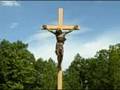 GUY AND PAT LAVIOE CROSS IN THE WOODS
