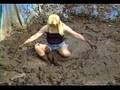 Chris in Daisy Dukes in mud pit