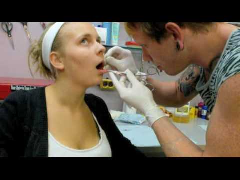 my friend michelle gets her spiderbites pierced! :) woop! song, i'll take 