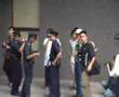 Riot police vs four silent protesters in Singapore