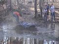 four wheeler stuck in pond