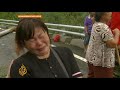 Hundreds of people are still missing in Taiwan, four days after Typhoon Morakat hit the island. It's feared they've been buried by landslides and drowned in floods triggered by the storm. Al Jazeera's Steve Chao sent this exclusive report from the devastated Hsiao Lin Village, the worst-hit area in the country.